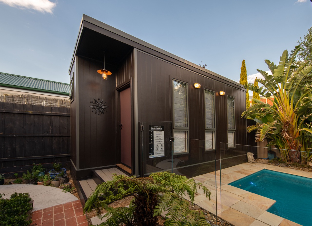 Home office studio by the pool designed by Lisa Elliott Interior Design, creating a resort-inspired work-from-home space in Melbourne.